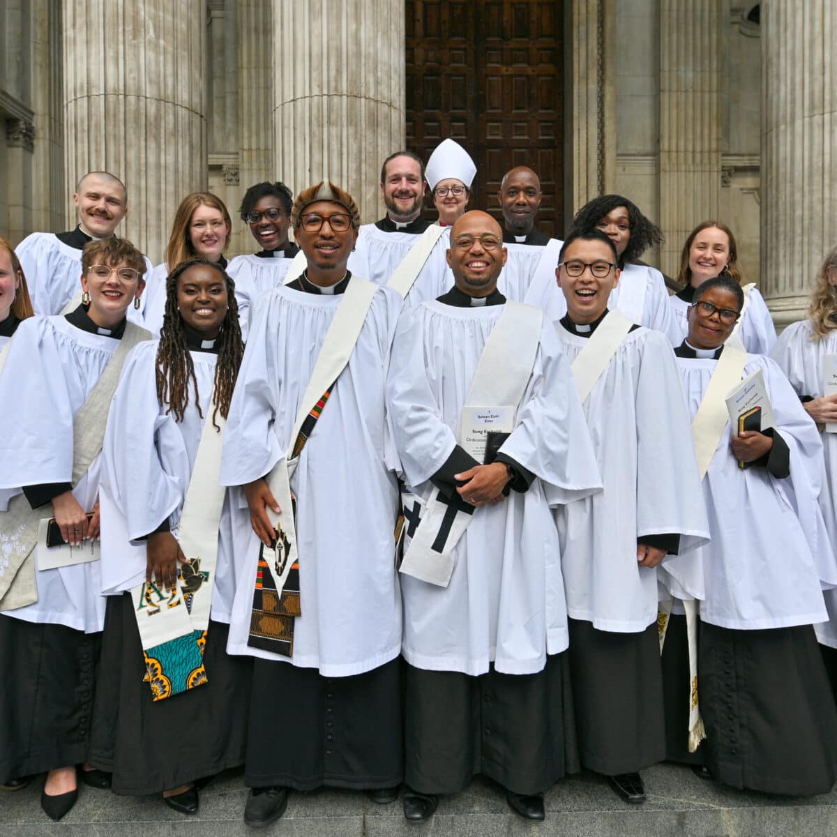 Group of ordinands on the steps of St Paul's cathedral