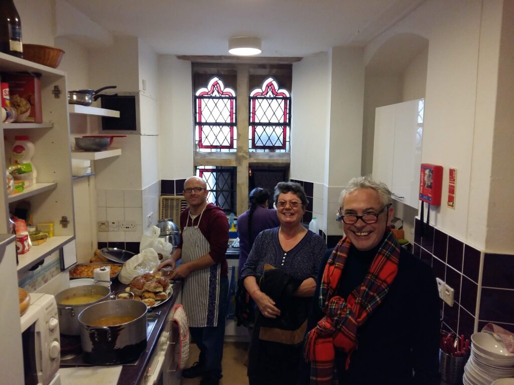 Church community kitchen with people working and smiling